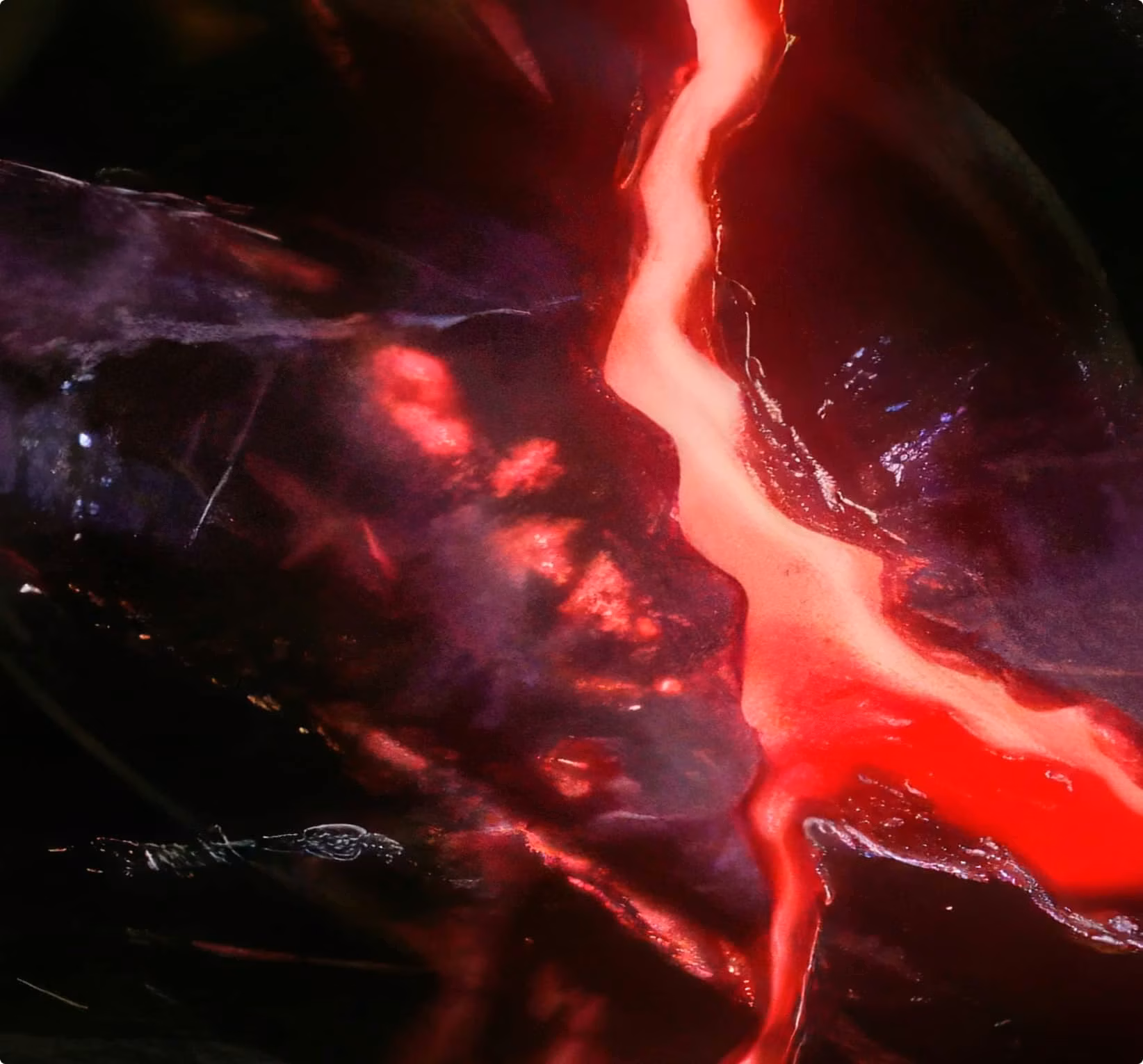 FAQs Background Image of the Onyx Rock with a red lava core.